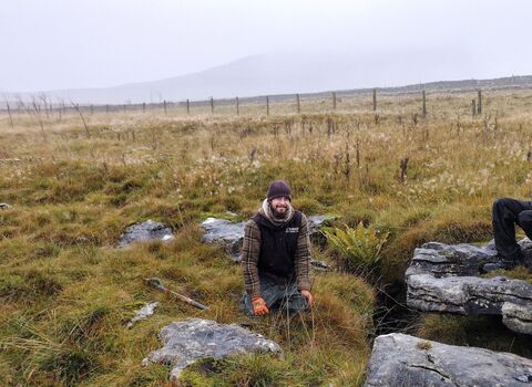 Landscape photograph of three members of the Wild Ingleborough team working outdoors